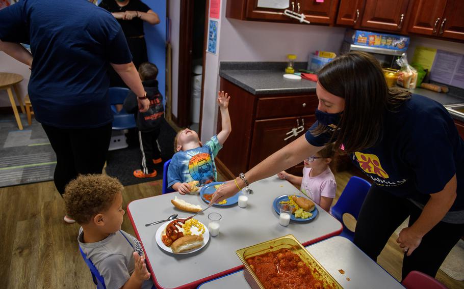 Kelly Soyka, 34, serves a meal at Begin With Us Pre-K Center in Altoona, Pa. 