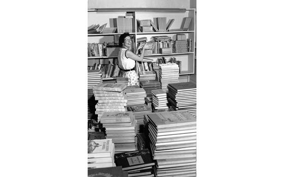 Chitose Air Base, Japan, Sept. 1957:  All over Chitose Air Base parents and educators are getting ready for the upcoming school year 57/58 and it takes a lot of books to help second and third grade youngsters learn their lessons. Mary R. Birdsall, who teaches these grades at the Chitose Dependent School, checks the texts her pupils will begin using on Monday. Some 380 dependent children of personnel stationed at the air base will enroll into one of the two schools for dependent children: the grade school at Chitose AB, for children in kindergarten through eighth grade, and the Crawford school at Crawford Housing Annex, 30 miles away.

Looking for Stars and Stripes’ historic coverage? Subscribe to Stars and Stripes’ historic newspaper archive! We have digitized our 1948-1999 European and Pacific editions, as well as several of our WWII editions and made them available online through https://starsandstripes.newspaperarchive.com/

META TAGS: Pacific; DoDEA; DODDS; school; education; teacher; textbooks; school library; back to school; H.K. Barnett