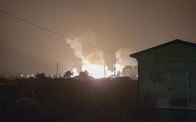In am image taken from video, flames and smoke rise from a military airbase Wednesday, Oct. 5, 2022, in Gangnueng, South Korea. South Korea’s Joint Chiefs of Staff said no injuries were reported from the explosion which involved a short-range Hyumoo-2 missile. (Kim Hee Soo via AP)