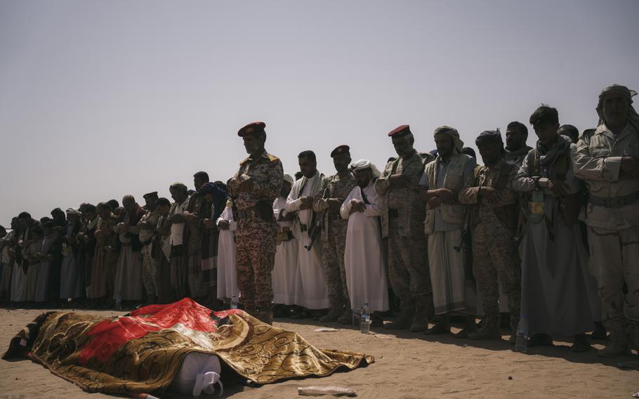 Mourners gather Aug. 18 to remember soldiers Abdo al-Kahli and Ibrahim al-Qamhi. 