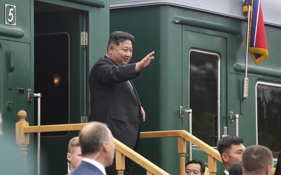 In this photo released by Government of Primorsky Krai Region, North Korea’s leader Kim Jong Un waves as he boards his train prior to leaving Artyom, near Vladivostok, Russian Far East on Sunday, Sept. 17, 2023.