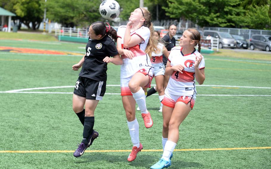 Priscilla Ramirez and Rose McGrath battle for the ball.