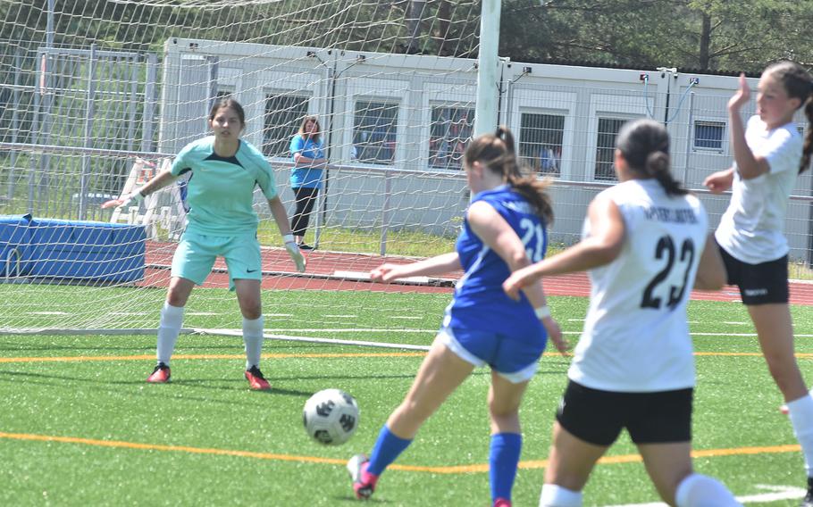 Kaiserslautern goalie Rihanna Martin gets set to stop a shot from Ramstein's Olivia Davis on Monday, May 20, 2024, during the opening day of the DODEA European Division I girls soccer championships at Ramstein Air Base, Germany.