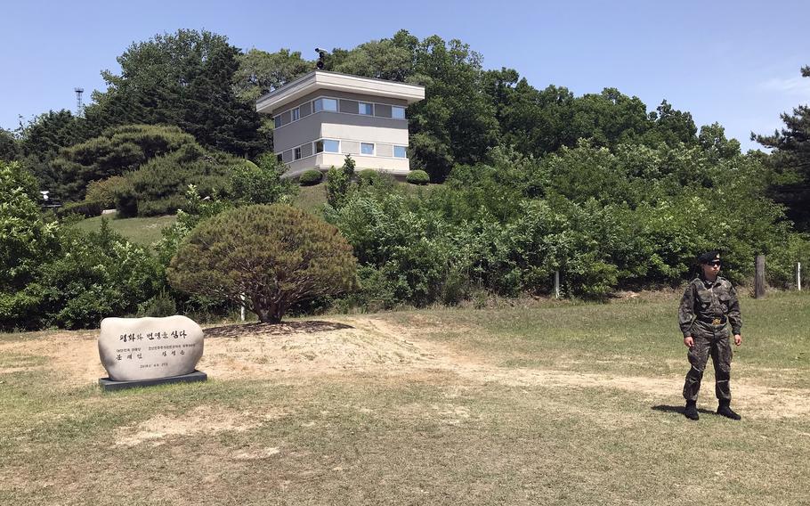 A South Korean soldier stands guard near a small tree on the southern side of the Joint Security Area in the Demilitarized Zone, May 29, 2019. It was planted a year earlier to mark a historic summit between North Korean leader Kim Jong Un and then-South Korean President Moon Jae-in. 