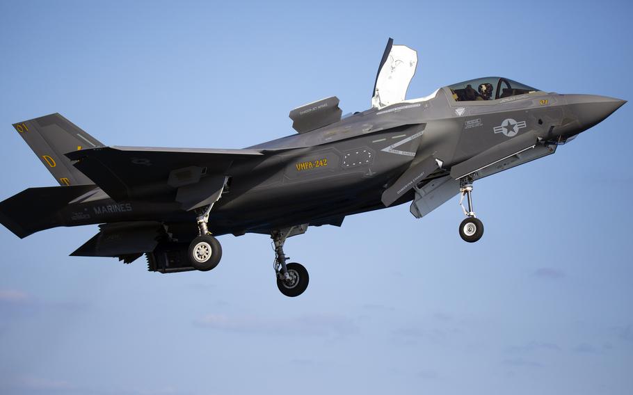 An F-35B Lightning II from Marine Fighter Attack Squadron 242 conducts a vertical landing aboard the Japanese carrier JS Izumo off the coast of Japan, Sunday, Oct. 3, 2021.