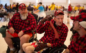 Todd Kemery, a former Marine from Shakopee, clowns around with a plastic axe belonging to Tim Valentin, left, an Army veteran from Belle Plaine, before opening ceremonies Thursday for the 44th annual National Veterans Wheelchair Games. (Jeff Wheeler / The Minnesota Star Tribune)