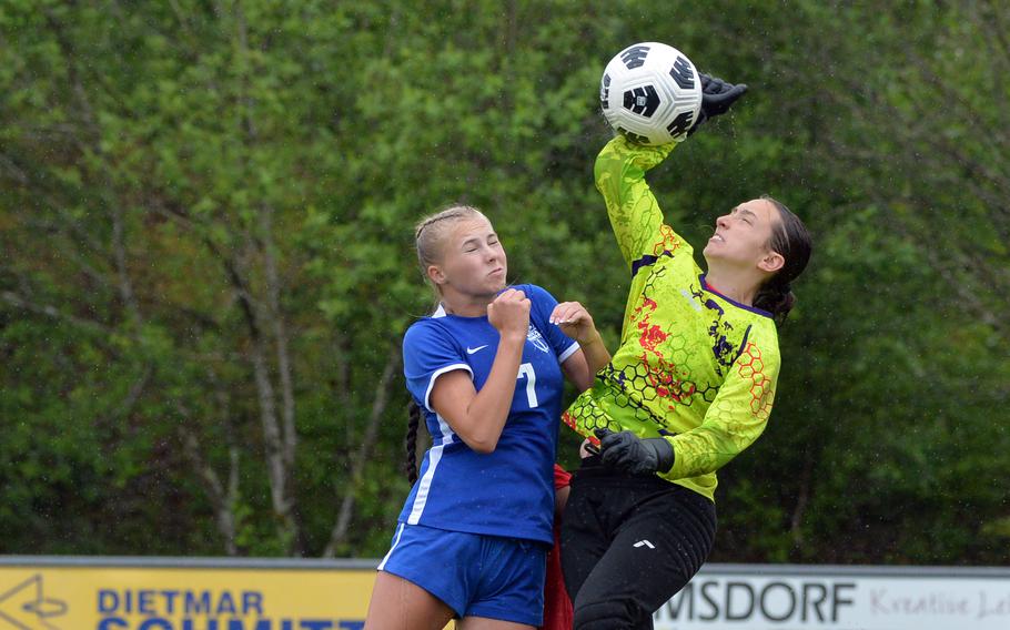 Aviano goalie Paige Rogers knocks the ball out of the box against Rota’s Gracelyn Markowski in a Division II game won by the Admirals 4-0, at the DODEA-Europe soccer finals at Reichenbach-Steegen, Germany, May 21, 2024. 