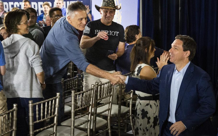 Florida Gov. Ron DeSantis, a Republican candidate for president, greets guests before speaking during a town hall event at the Alpine Grove Banquet Facility in Hollis, N.H., on June 27, 2023. Once endorsed by Donald Trump, DeSantis is struggling to win support over the former president in the race for the party’s presidential nomination.