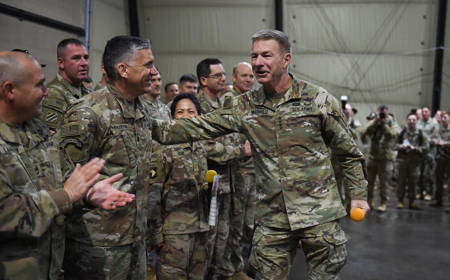 Army Chief of Staff Gen. James McConville recognizes Lt. Col. Steven Button on having the most deployments of soldiers at Mihail Kogalniceanu Air Base, Romania, during his visit on Dec. 16, 2022. Within the division, commanders say a majority of the soldiers are on their first deployment overseas. 