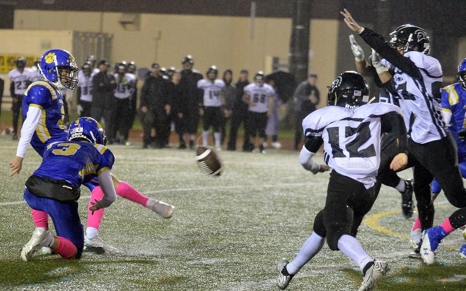 Yokota's Senna Solberg has his overtime field-goal try blocked by Zama's Greg Horton.