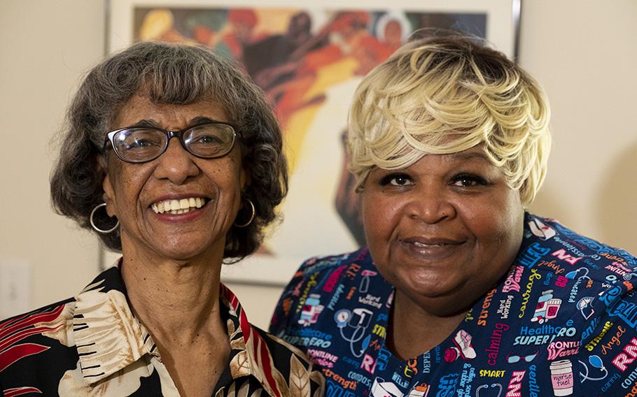 Lillie Williams, right, is seen in her residence in Virginia Beach, Va., alongside her nursing assistant Shirley Braswell. Williams’ husband was diagnosed with dementia three years ago.