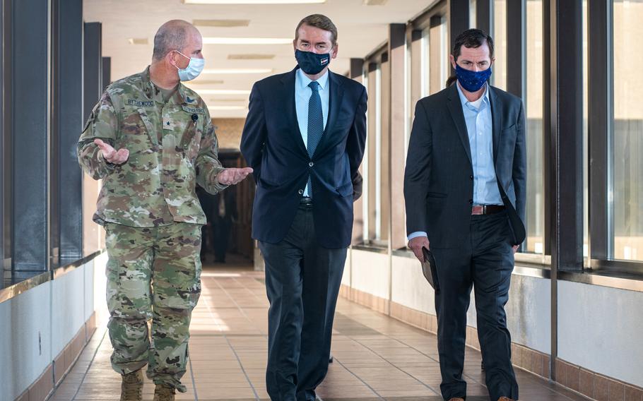 From left, Brig. Gen. Dennis Bythewood, deputy commander of Joint Task Force-Space Defense, escorts Sen. Michael Bennet and Rep. Jason Crow during their visit to the JTF-SD operations floor located on Schriever Space Force Base, Colo., on Oct. 15, 2021. During their visit, they received a briefing on the mission and vision of various organizations in support of the newly formed U.S. Space Force.