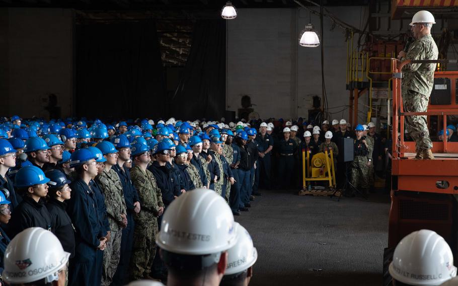 Master Chief Petty Officer of the Navy Russell Smith addresses the crew of the USS George Washington in Newport News, Va., on April 22, 2022. Smith encouraged sailors to get used to the hardships they face while serving aboard a dry-docked ship. 