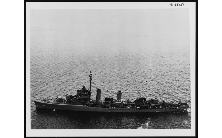 A black and white photo of a Navy destroyer at sea.