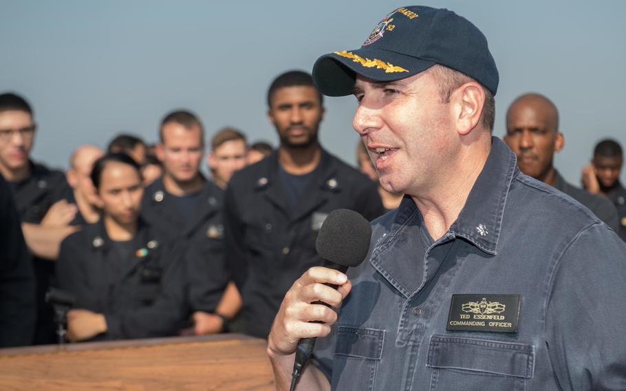 Then-Cmdr. Theodore Essenfeld speaks during an all-hands call on the USS Pearl Harbor flight deck on Oct. 24, 2017. Essenfeld, now a Navy captain, was charged Feb. 6, 2023, in federal court with cyberstalking a woman.