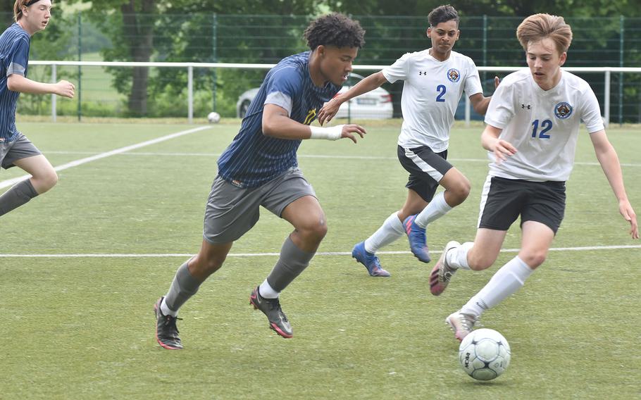 Brussels' Grant Rohrer shadows Ansbach senior captain Shane Nesbitt on Monday, May 16, 2022, at the DODEA-Europe boys Division III soccer championships at Reichenbach, Germany.