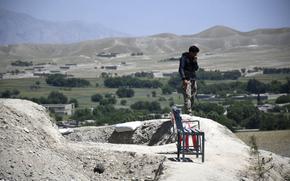 A soldier with the former Afghan National Armys Territorial Force looks out from his outpost in rural Nangarhar province of Afghanistan on May 10, 2020. The soldier's commander said the unit lacked enough ammunition to fight against the Taliban for more than a few minutes.