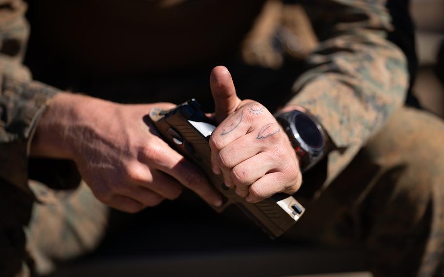 A Marine participates in a handgun training exercises at the Pohakuloa Training Range. 