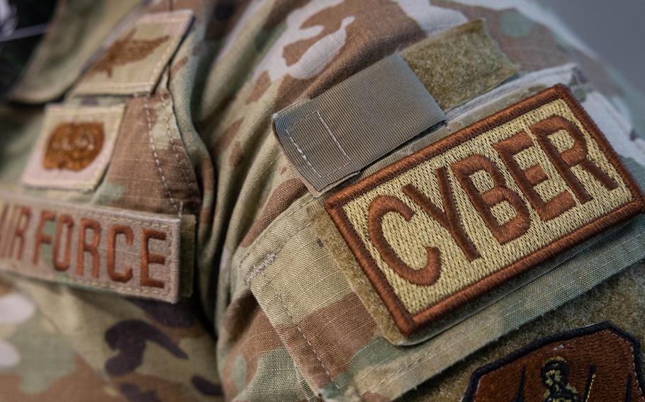 An airman wears a cyber duty identifier patch on his uniform. OpenAI, the artificial intelligence company behind ChatGPT, is working with the Pentagon to develop open-source cybersecurity software.