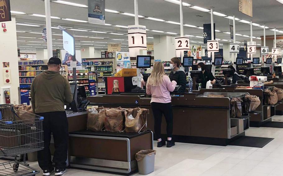 Commissary customers check out at Yokota Air Base, Japan, Friday, March 3, 2023.