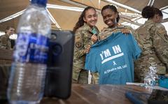 Airman 1st Class Mayra Mendez, and Tech. Sgt. Keonda Maxwell, 380th Expeditionary Force Support Squadron, pose together after a Teal Team 6 induction ceremony at Al Dhafra Air Base, United Arab Emirates, June 18, 2021. 