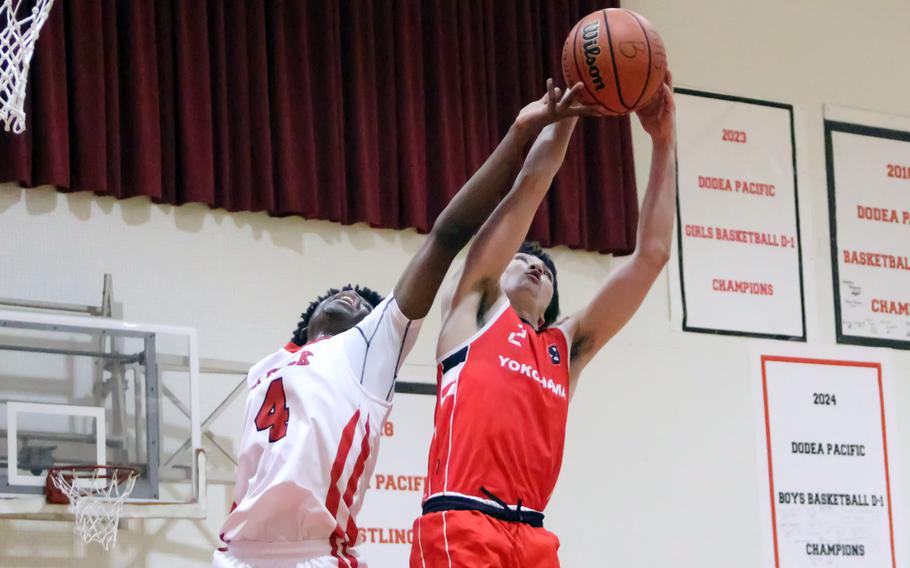 Kai Hicks grabs a rebound.
