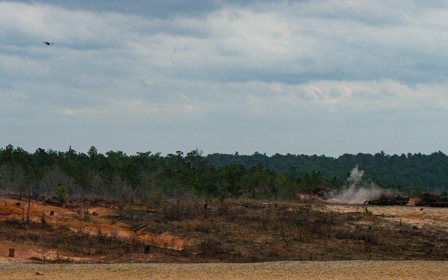 A Cerberus GLH drone fires a 40mm grenade round during an Army Expeditionary Warfare Experiment demonstration of robotics capabilities in an infantry platoon on Tuesday, Feb. 27, 2024, at Fort Moore, Ga. 