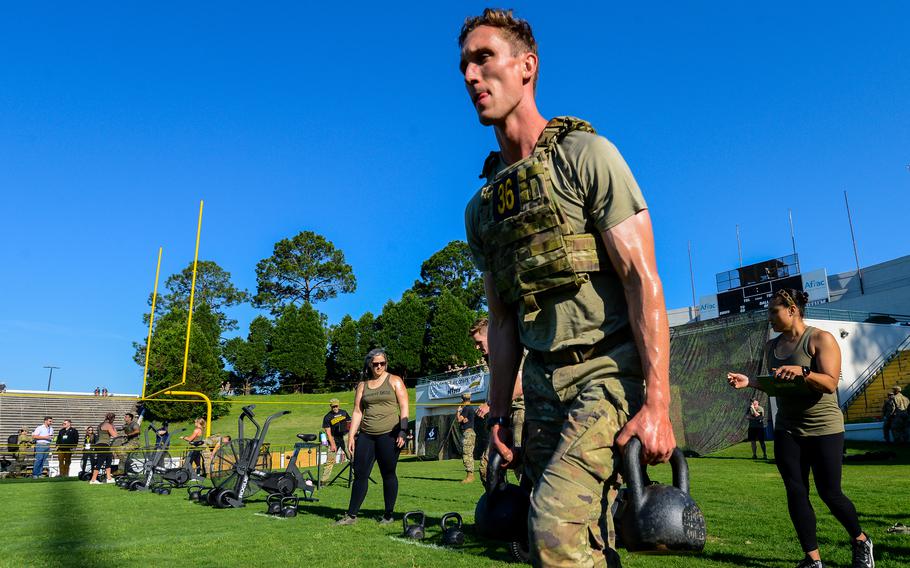 Army Capt. Luke Ebeling carries two 40-pound kettlebells during the second day of the Best Ranger Competition, Saturday, April 15, 2023, at A.J. McClung Memorial Stadium in Columbus, Ga. Ebeling and his teammate Spc. Justin Rein, both from the 75th Ranger Regiment, went on to win the 39th annual competition. 