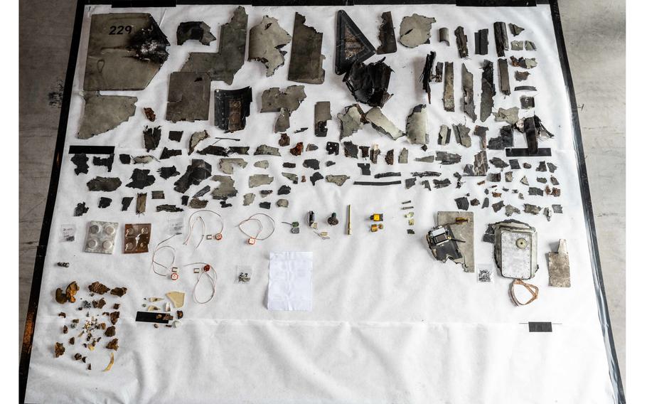 Debris fragments are displayed from what the U.S. Navy says was an Iranian-made Shahed-136 aerial drone collected aboard the M/T Pacific Zircon on Nov. 16, 2022.