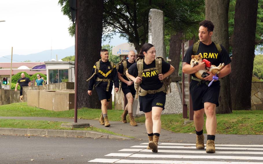 A ruck walk by about 25 soldiers, spouses and some energetic canines marked an opportunity to remember and reflect during Suicide Prevention and Awareness Month at Camp Zama, Japan, Thursday, Sept. 22, 2022.