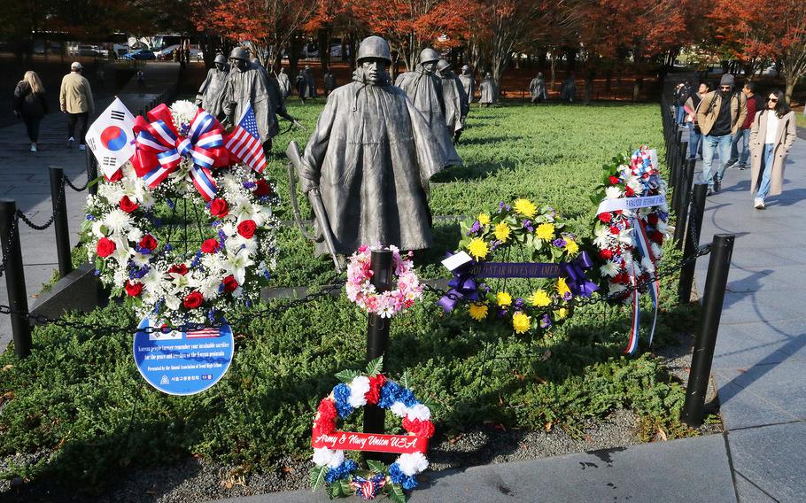 Floral tributes at the Korean War Memorial on Veterans Day in Washington, November 11, 2023.