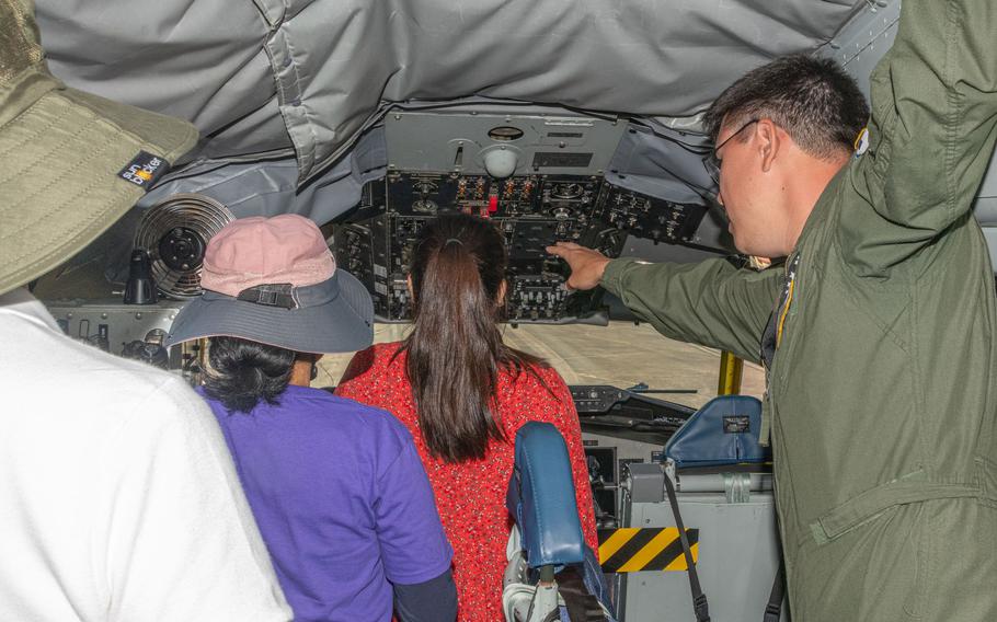 A member of an air refueling squadron briefs attendees on the cockpit of their aircraft during the Beyond the Horizon Air and Space Show at Maxwell Air Force Base, Ala., Saturday, April 6, 2024. 