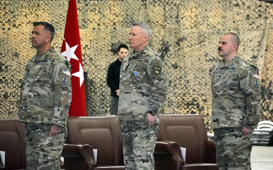 Military leaders stand at attention during an activation ceremony for U.S. Space Forces Korea at Osan Air Base, South Korea, Wednesday, Dec. 14, 2022. From left to right: Space Force Brig. Gen. Anthony Mastalir, commander of Space Forces Indo-Pacific; Army Gen. Paul LaCamera, commander of U.S. Forces Korea; and Space Force Lt. Col. Joshua McCullion, commander of Space Forces Korea.
