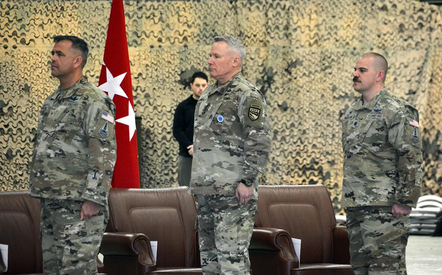 Military leaders stand at attention during an activation ceremony for U.S. Space Forces Korea at Osan Air Base, South Korea, Wednesday, Dec. 14, 2022. From left to right: Space Force Brig. Gen. Anthony Mastalir, commander of Space Forces Indo-Pacific; Army Gen. Paul LaCamera, commander of U.S. Forces Korea; and Space Force Lt. Col. Joshua McCullion, commander of Space Forces Korea.