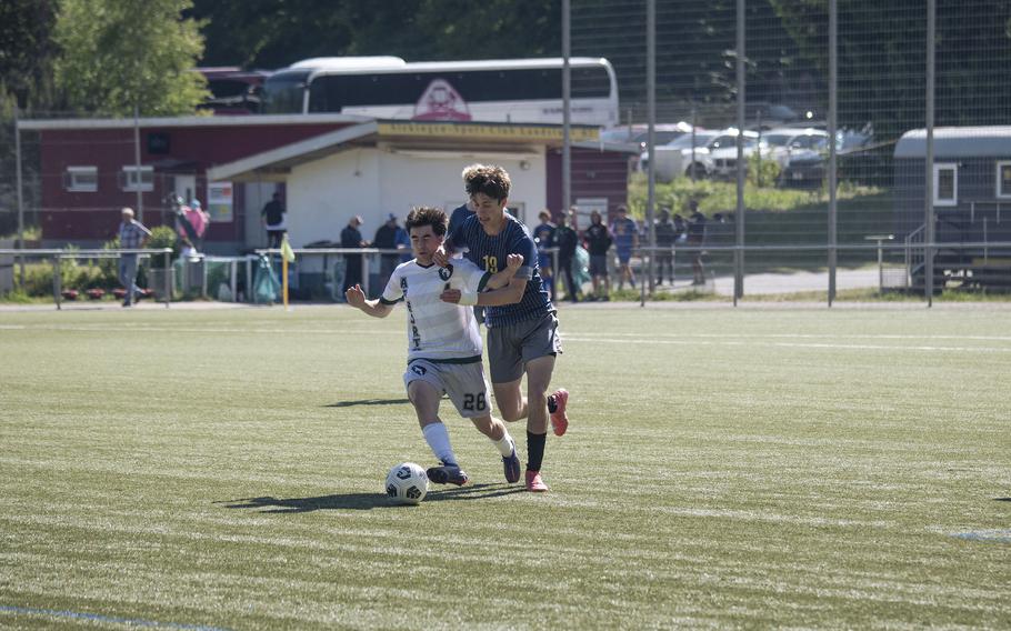 Nathan Kirstein, a junior with AFNORTH, is contested by Ansbach Cougars junior Nathan Arreguin in a tough matchup during the 2025 DODEA European Division III soccer championships in Landstuhl, Germany on May 19, 2025.