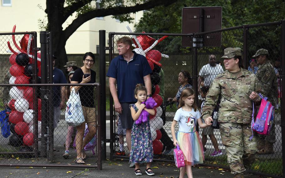 Students and their parents arrive for the first day of classes at Joan K. Mendel Elementary School on Yokota Air Base, Japan, Aug. 22, 2022.