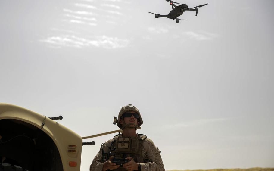 A Marine flies a DJI Mavic Pro drone while deployed to the Middle East in 2017. The U.S. Army needs to get small, off-the-shelf drones to troops in the field and let them experiment, a March 6, 2024, report by the Modern War Institute at West Point argues.