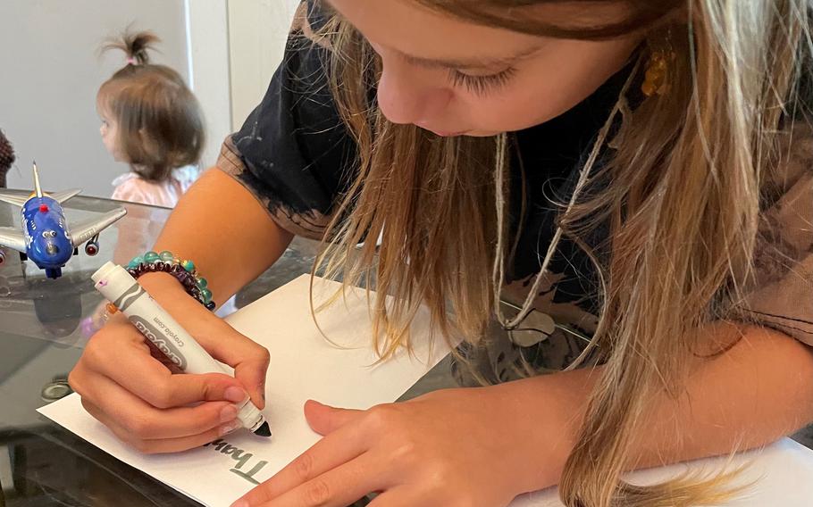 Valentina Carmona, 9, making cards at her home less than two miles from Surfside. She and her family know many of the residents at Champlain Towers South. 