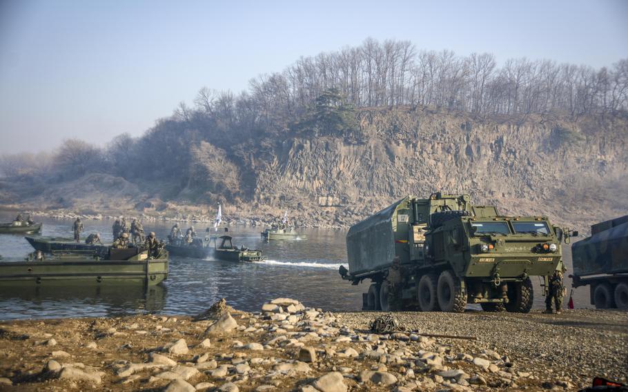 U.S. Army soldiers of the 11th Engineer Battalion, 2nd Infantry Division, and South Korean troops of the 5th Engineer Brigade prepare to assemble a bridge during wet gap training at the Imjin River, South Korea, March 20, 2024. 