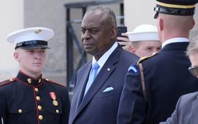 Defense Secretary Lloyd Austin stands before greeting Kenya's President William Ruto at the Pentagon on May 24, 2024.