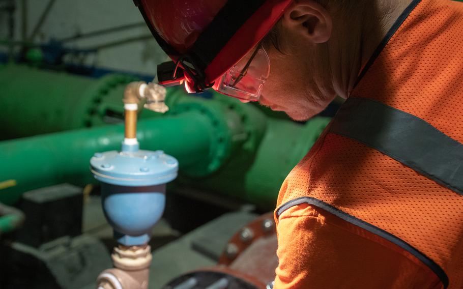 Matt Cornman, a Navy contractor, performs a routine visual inspection on a water pipe at the Red Hill Well near Joint Base Pearl Harbor-Hickam, Hawaii, on March 8, 2022.