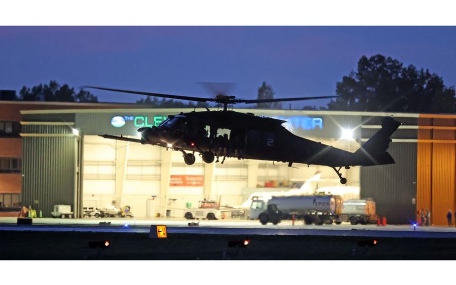 Military helicopters depart Cuyahoga county airport for evening training exercises.
