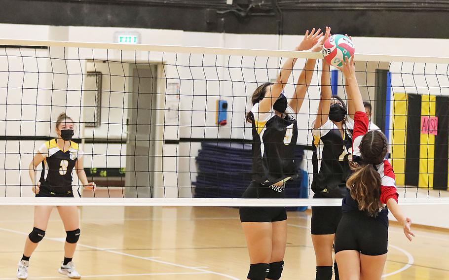 Marissa Castillo of the Aviano Saints attempts to score on Gianna Barea and Sofia Pasion of the Vicenza Cougars during the DODEA-Europe Division II tournament in Vicenza, Italy.