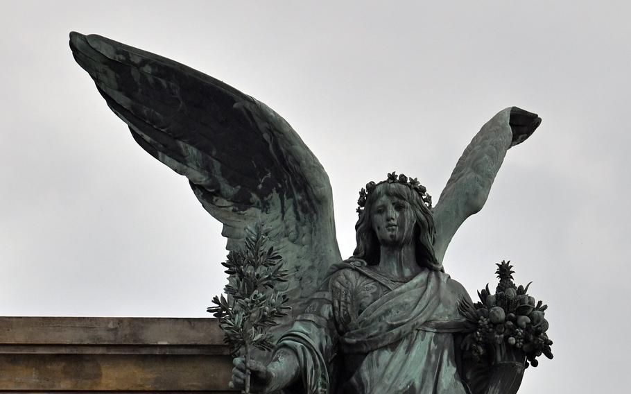 A statue of an angel representing peace is part of the ensemble that makes up the Niederwald Monument near Ruedesheim, Germany. Opposite it is an angel blowing a horn as a depiction of war.