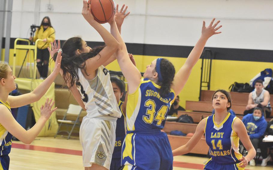 Sigonella's Laney Reardon blocks the shot of Vicenza's Gabriela Sanchez in the DODEA-Europe Division II basketball championships Friday, March 4, 2022.