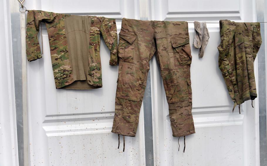 An Army uniform hangs out to dry at the Life Support Area in Bemowo Piskie where soldiers from 1st Squadron, 2nd Cavalry Regiment are living as they rotate out of Poland, heading back to Vilseck, Germany. The unit is being replaced in NATO's Battle Group Poland by 2nd Squadron, 278th Armored Cavalry Regiment of the Tennessee National Guard. 