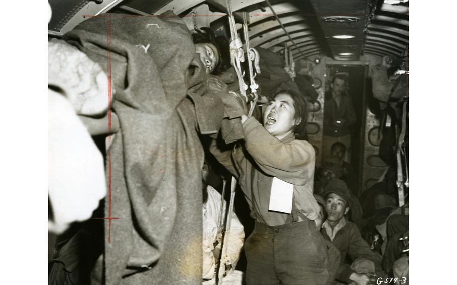 The original caption of this image — captured by an unknown U.S. Air Force photographer and published in the Pacific Stars and Stripes, Sept. 11, 1951 — read “En route to Japan from Korea aboard an evacuation transport, a Republic of Korea nurse, injured herself, aids in the care of a wounded ROK soldier.” Although the article ran with a number of images, this image is the only known image to have survived in Stars and Stripes’ Pacific archives.