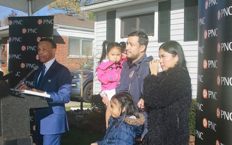 Army veteran Isaac Bashi, at right with his family, will be hosting Thanksgiving in a mortgage-free, renovated home that he received as part of a program offered by PNC Bank and the Military Warriors Support Foundation.