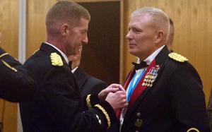 Maj. Gen. Joel “JB” Vowell, commander of U.S. Army Japan, awards Maj. Robert Bourgeau the Soldier’s Medal on Friday, June 9, 2023, during the 248th Army Birthday Ball at Kadena Air Base, Okinawa.