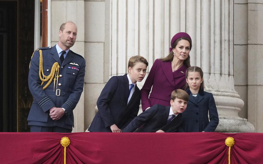 The Royal family looks from a balcony